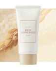 50 ml bottle of i'm from rice sunscreen with background of rice cereal