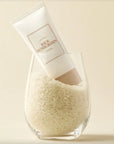 Picture of 50 ml bottle of i'm from rice sunscreen in a glass full of rice