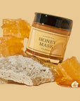 picture of i'm from honey mask with honey on it, honeycombs and rocks on the side with yellow background