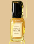 picture of i'm from honey serum with honey on it on a brown blackground