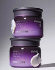2 bottles of 60 ml innisfree perfect 9 intensive cream on top of each others with some cream spread on them. Black background