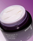 60 ml bottle of innisfree perfect 9 intensive cream opened with a purple background