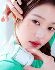 Asian woman pretty face using innisfree green tea seed hyaluronic serum